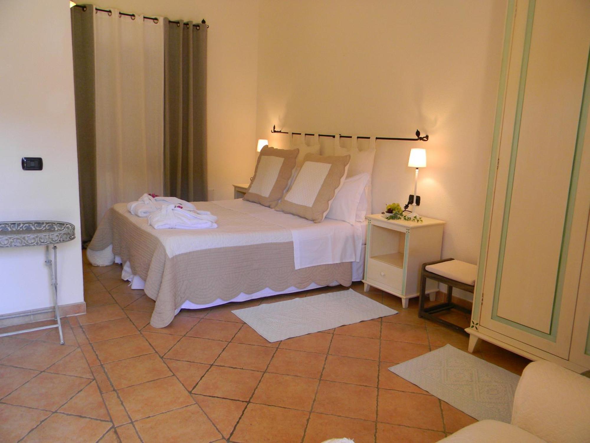 Relais Fenicottero Rosa Guest House Porto Taverna Room photo